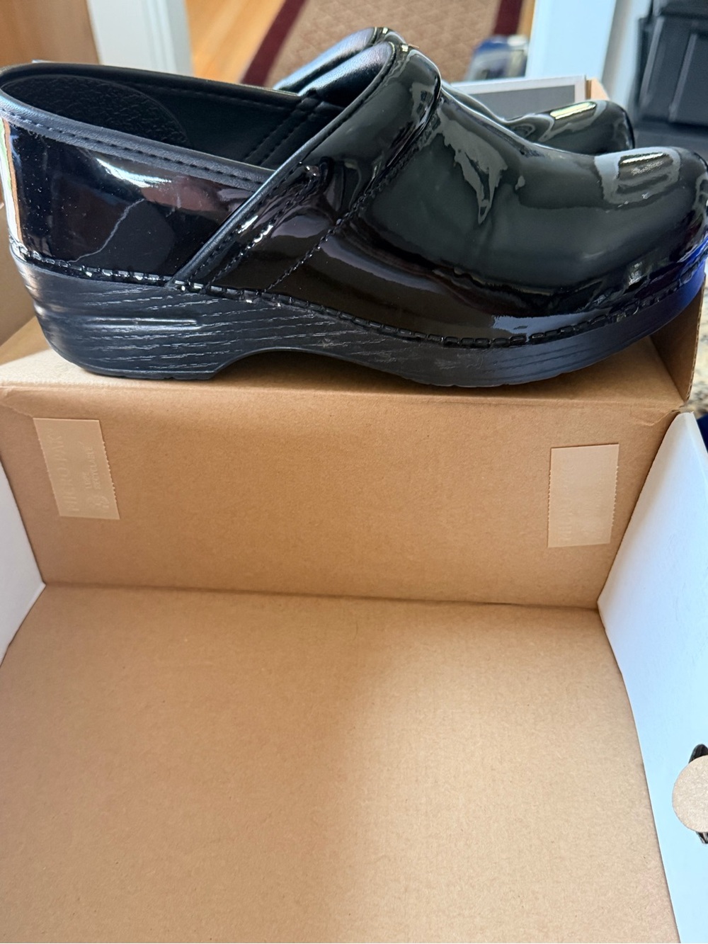 Dansko Women's Black Patent Slip-On Clogs